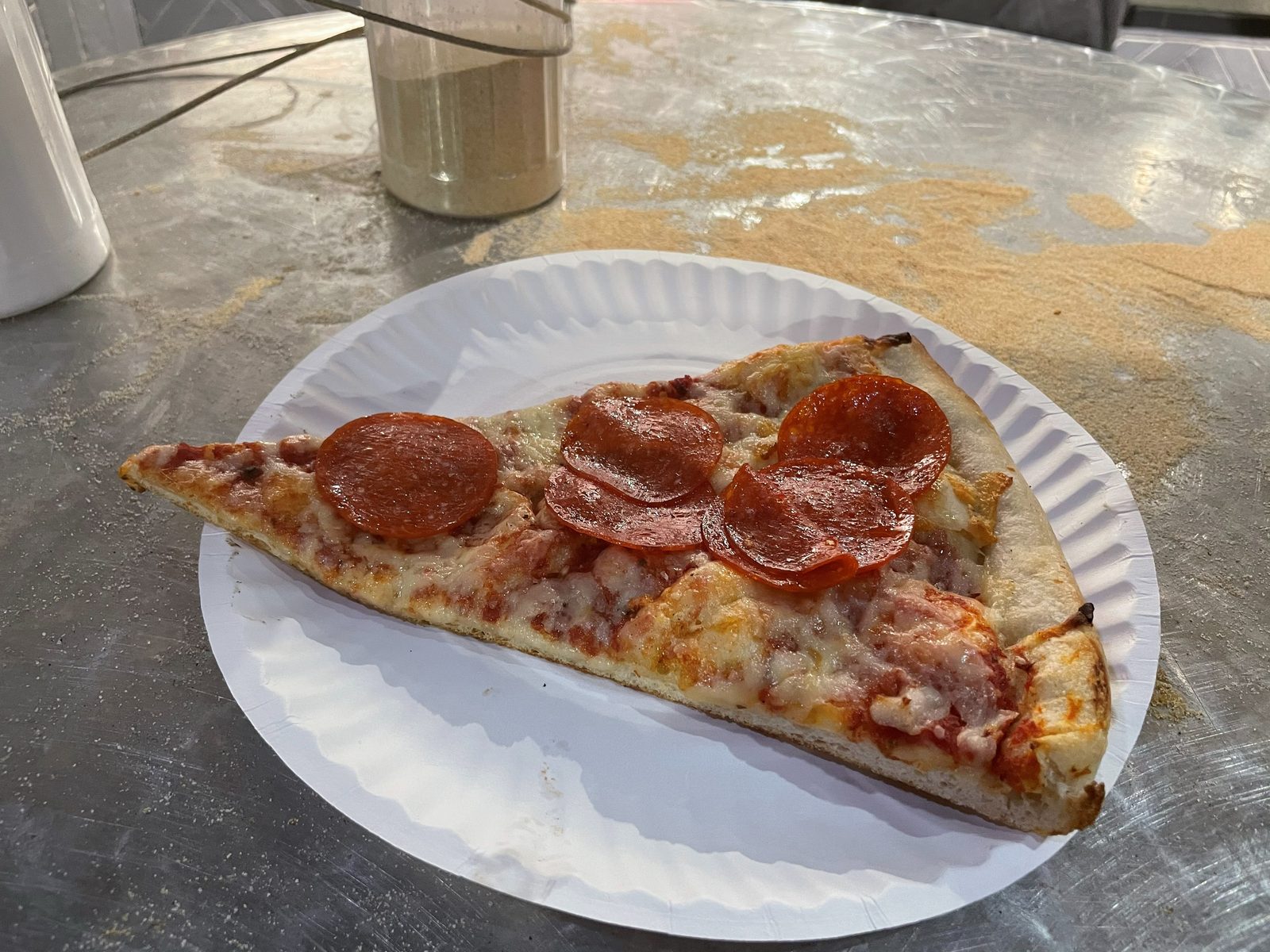 large foldable pepperoni slice on a paper plate, 2 Bros Pizza