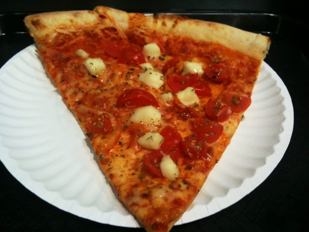 Slice topped with cherry tomatoes and mozzarella cubes, Capri Tavola Calda