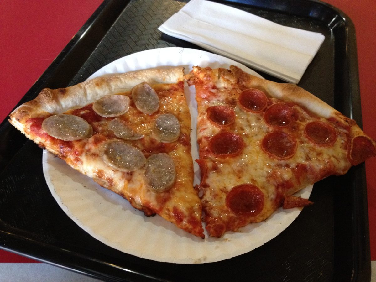 thin pepperoni slice beside a pale pickle-topped slice, Cincy By the Slice