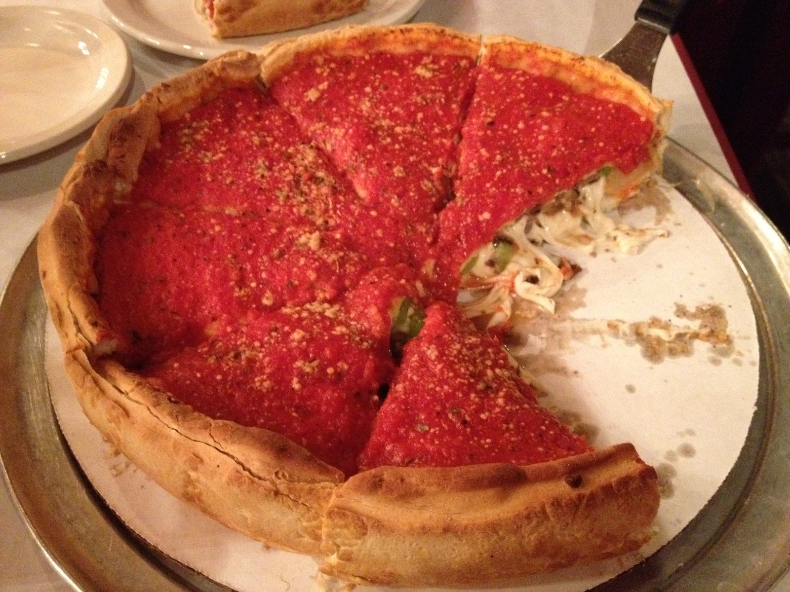 thick-crust deep dish wedge with glossy sauce on top, Giordano's
