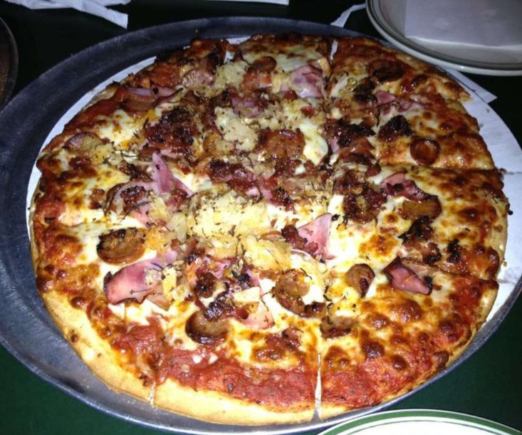 ham and pineapple pie flecked with herbs, Hounddog's Pizza