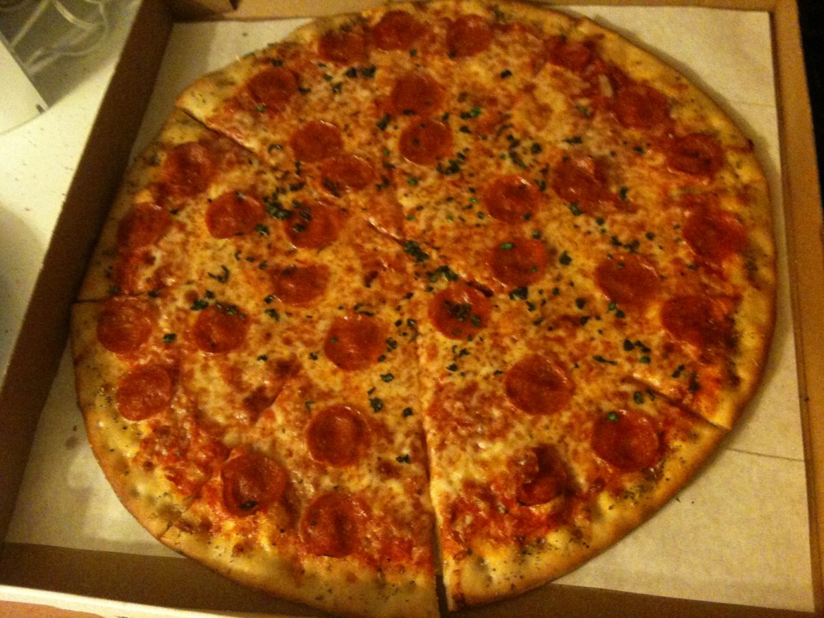 pepperoni pie flecked with herbs in a delivery box, NorthSlice Pizzeria