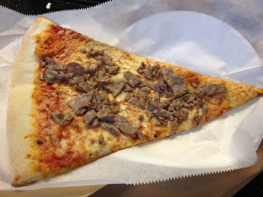 Foldable NY slice topped with chunky meat pieces, NYC Bagel Deli