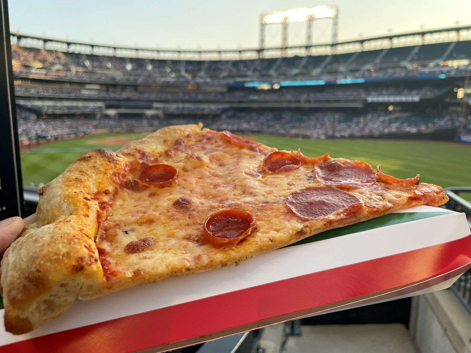 pepperoni slice held up at the ballpark, Papa Rosso Pizza (Citi Field)
