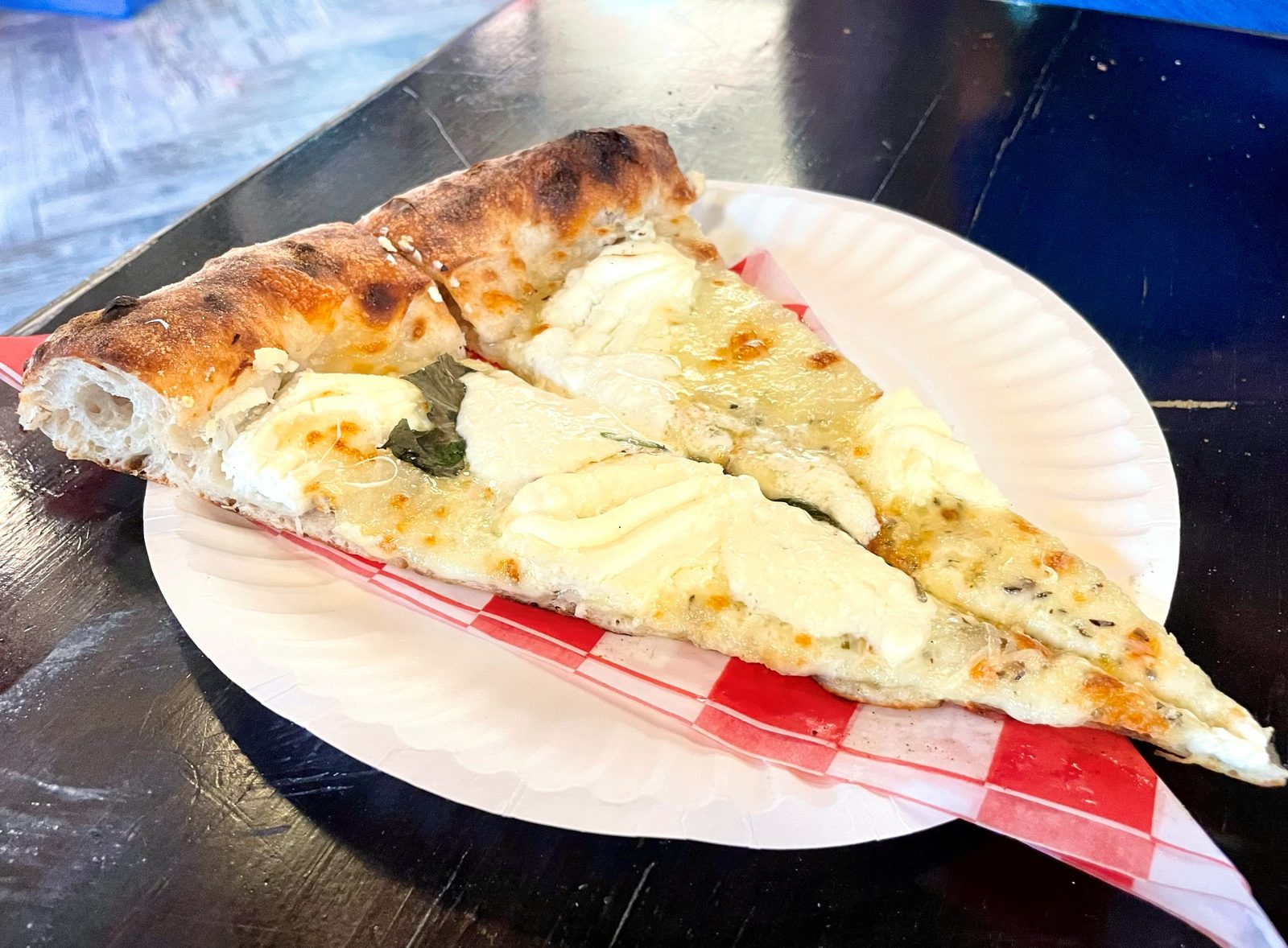 white slice with pools of melted cheese and blistered cornicione, Sauce Pizzeria