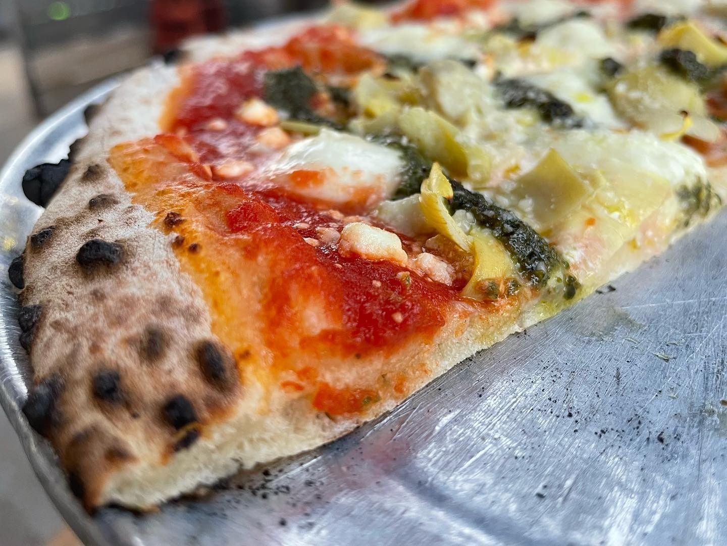 Close view of a pizza slice at A Tavola