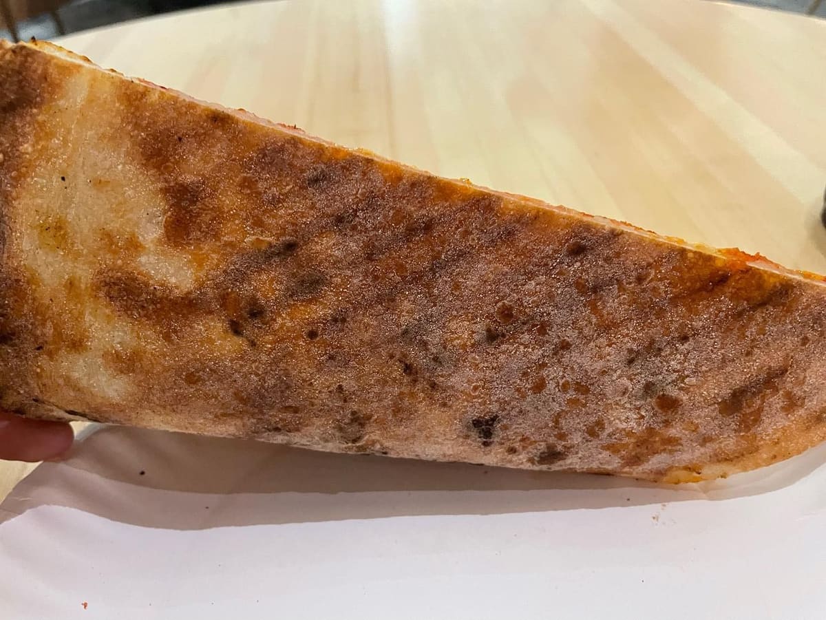 Underside of the pizza crust at Andy’s Pizza