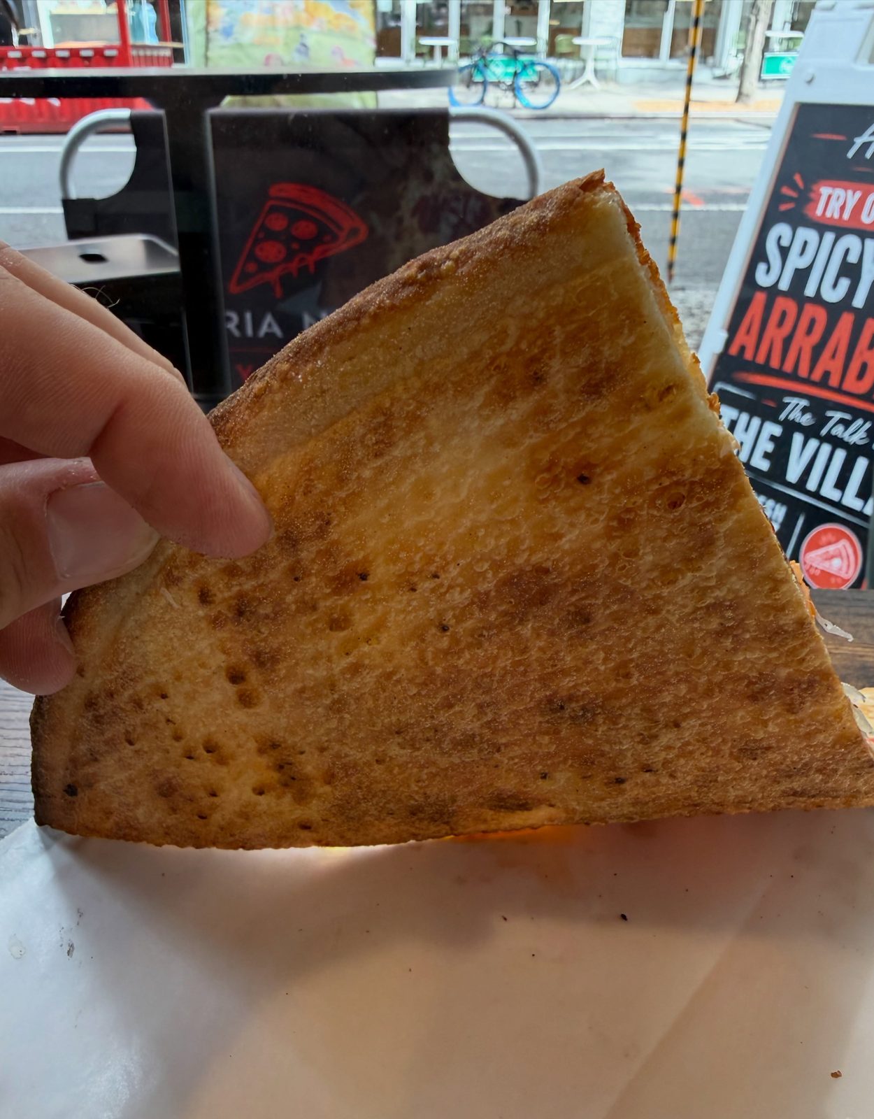 Underside of the Aria Nova slice, evenly browned across the base from the screen bake