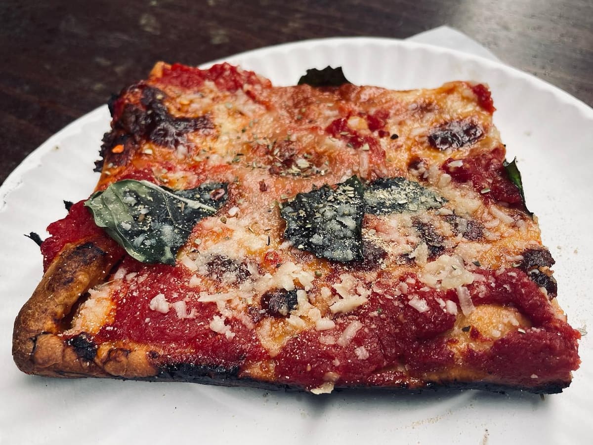 Square pizza slice at Artichoke Basille Pizza