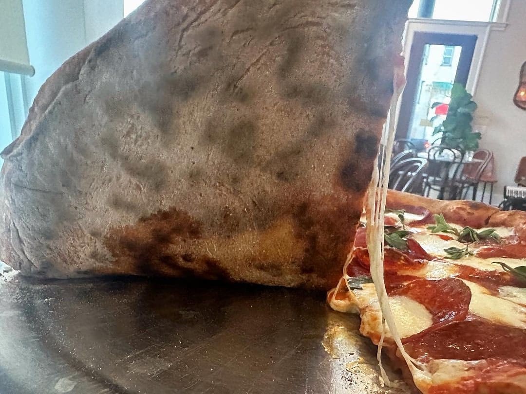 Underside of the pizza crust at Baker’s Table Bakery