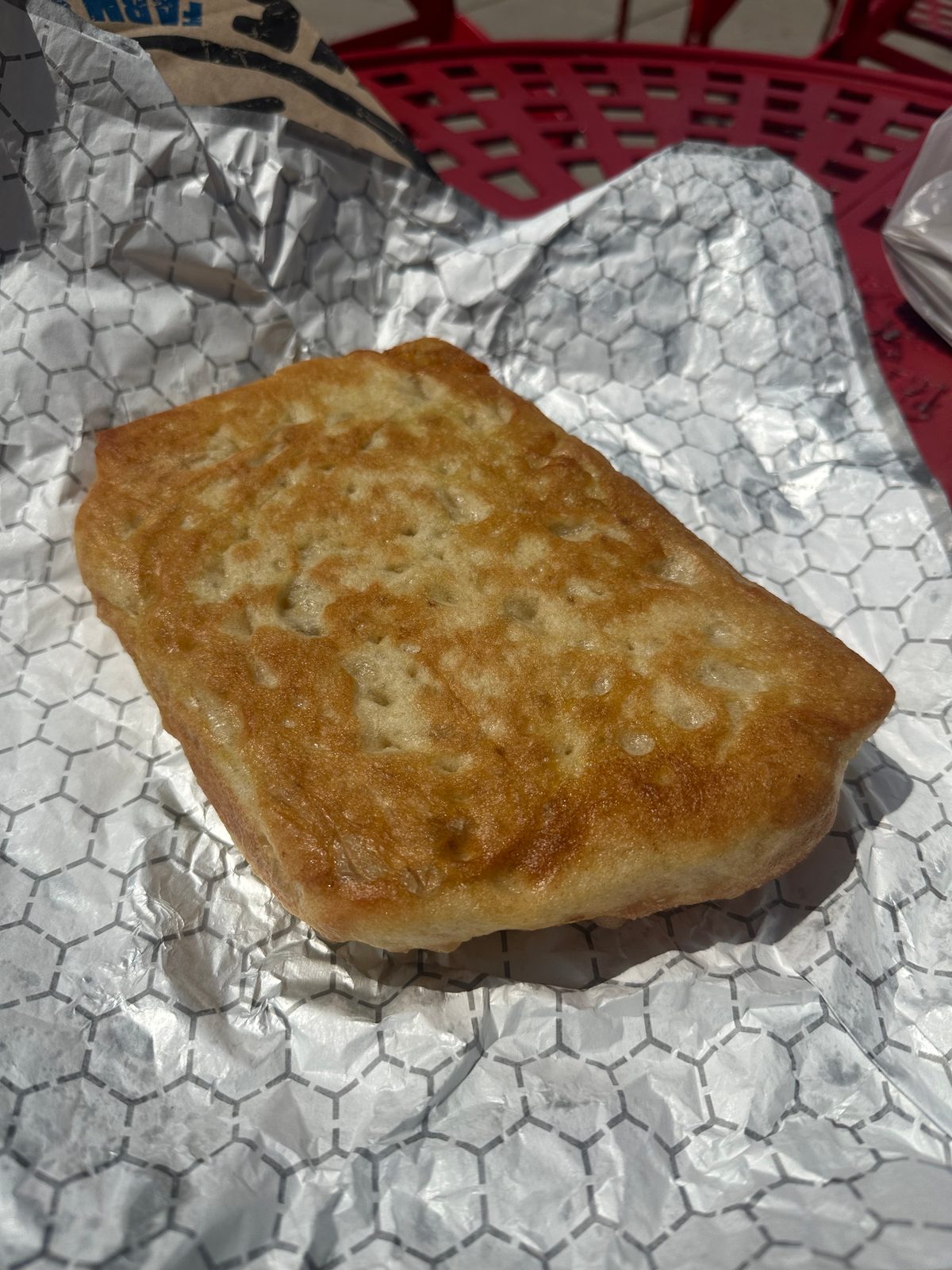 Underside of the focaccia, evenly golden and pale with no dark spots, Blue Oven Bakery