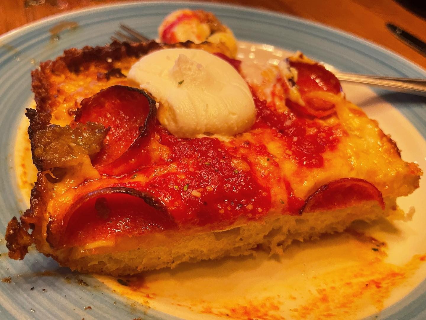 Square slice on a plate at Blue Pan Pizza