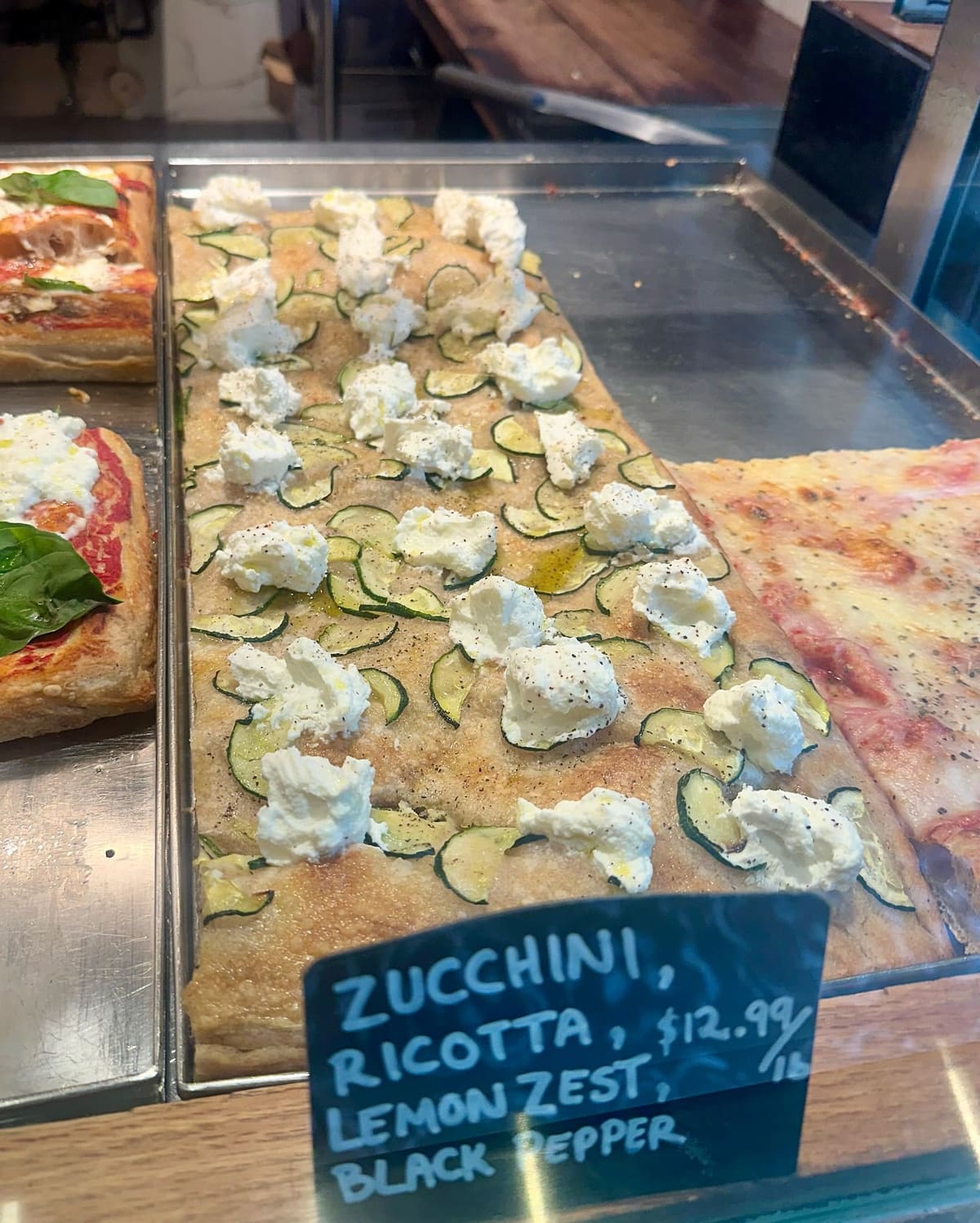 Pizza on display at Bonci Pizza