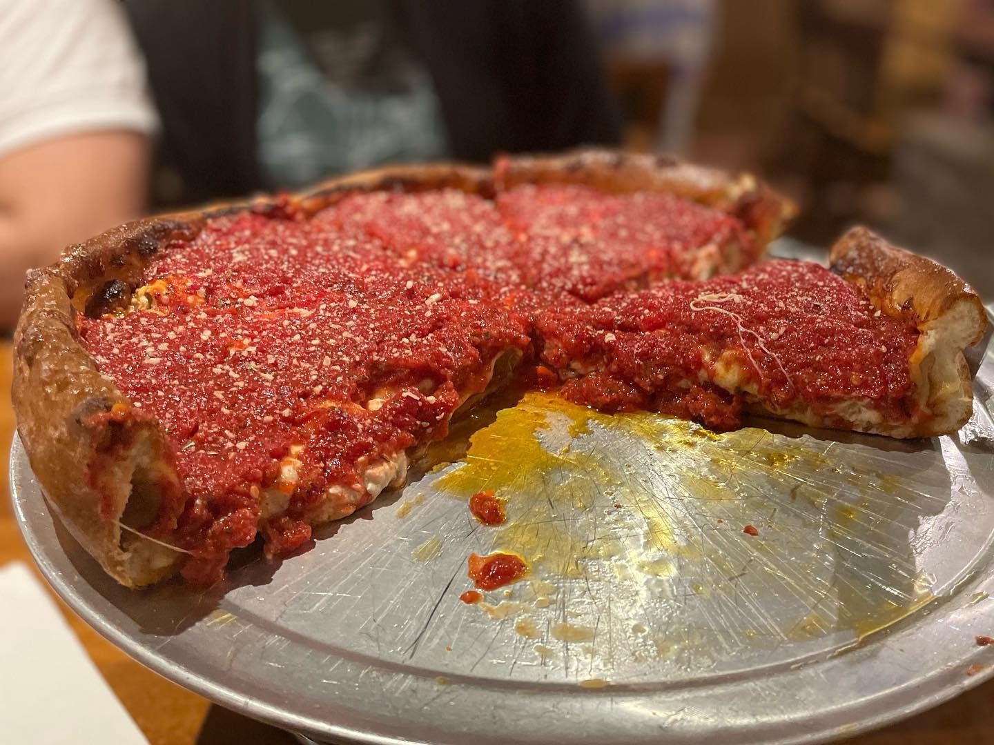 The deep dish pie with a slice taken at Bourbon House Pizza