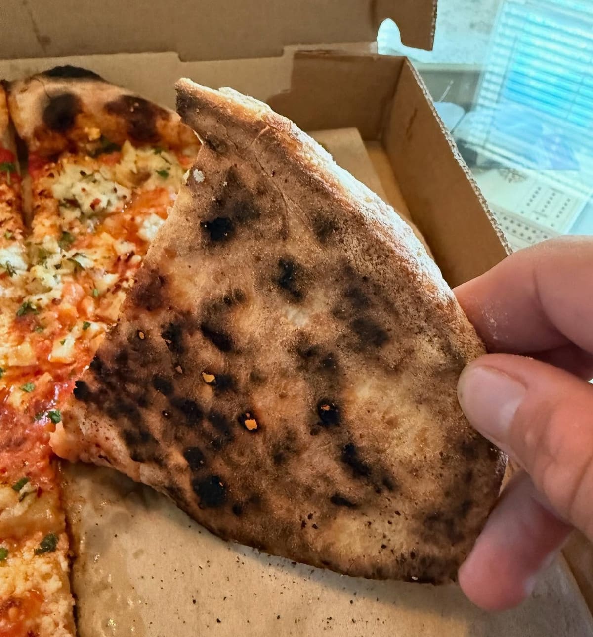 Underside of the pizza crust at Brewer’s Fork in Charlestown