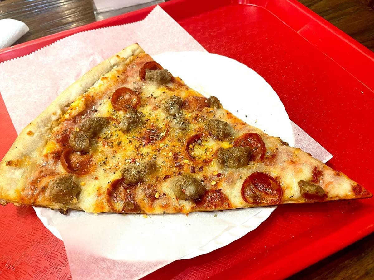 Pizza slice at Champion Pizza