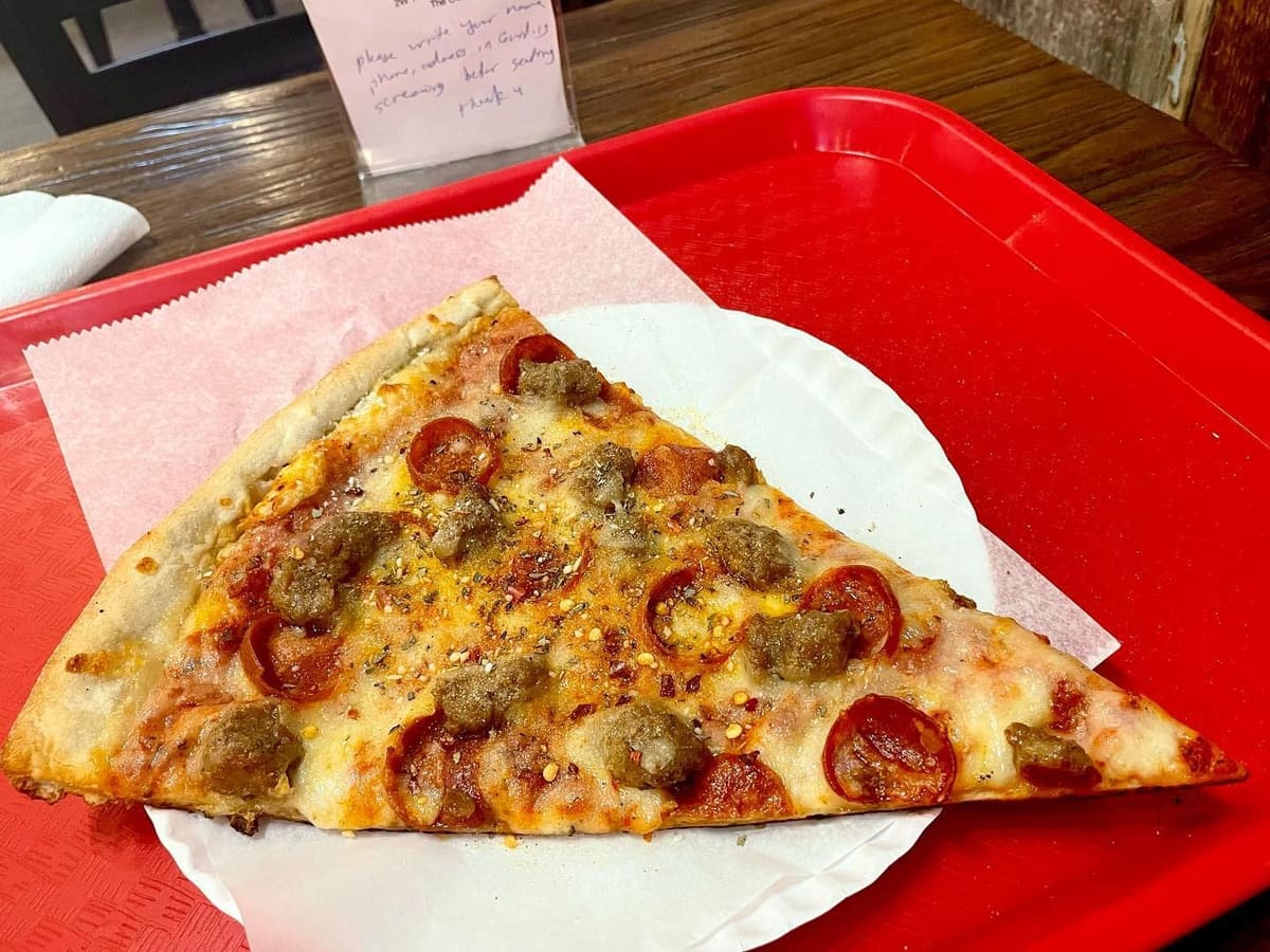 Pizza slice at Champion Pizza