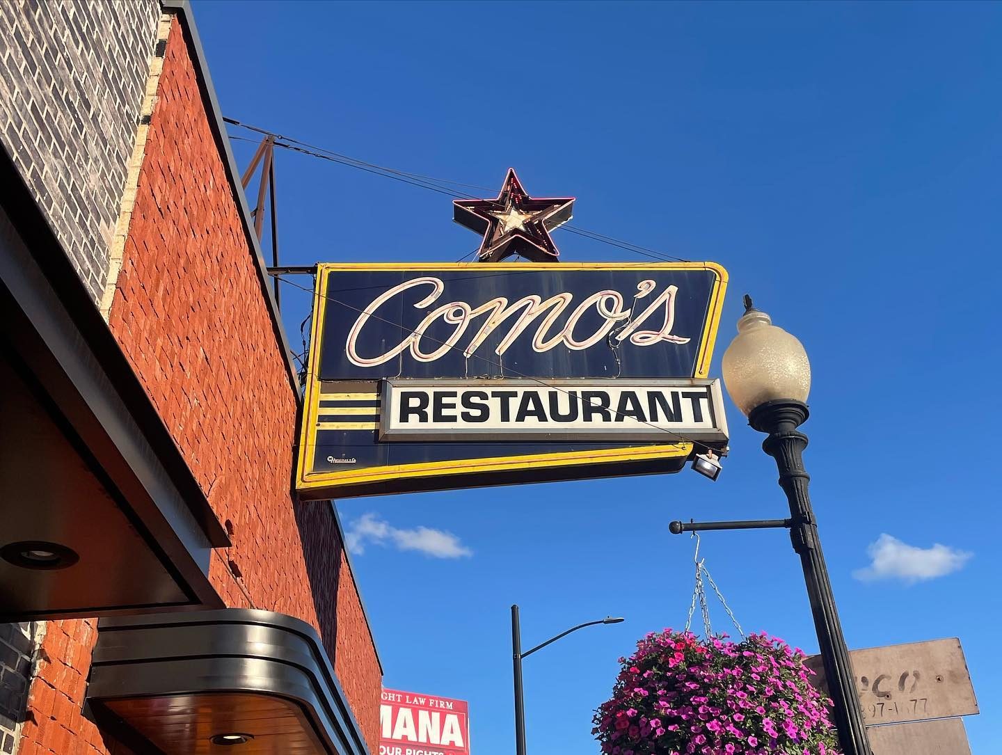 Restaurant sign outside at Como’s Restaurant