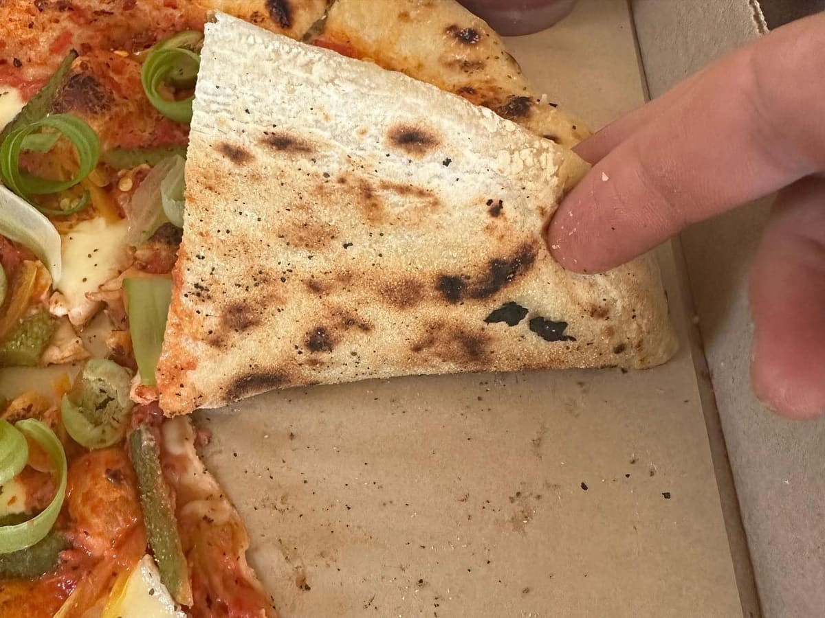 Underside of the pizza crust at Companion Pizza