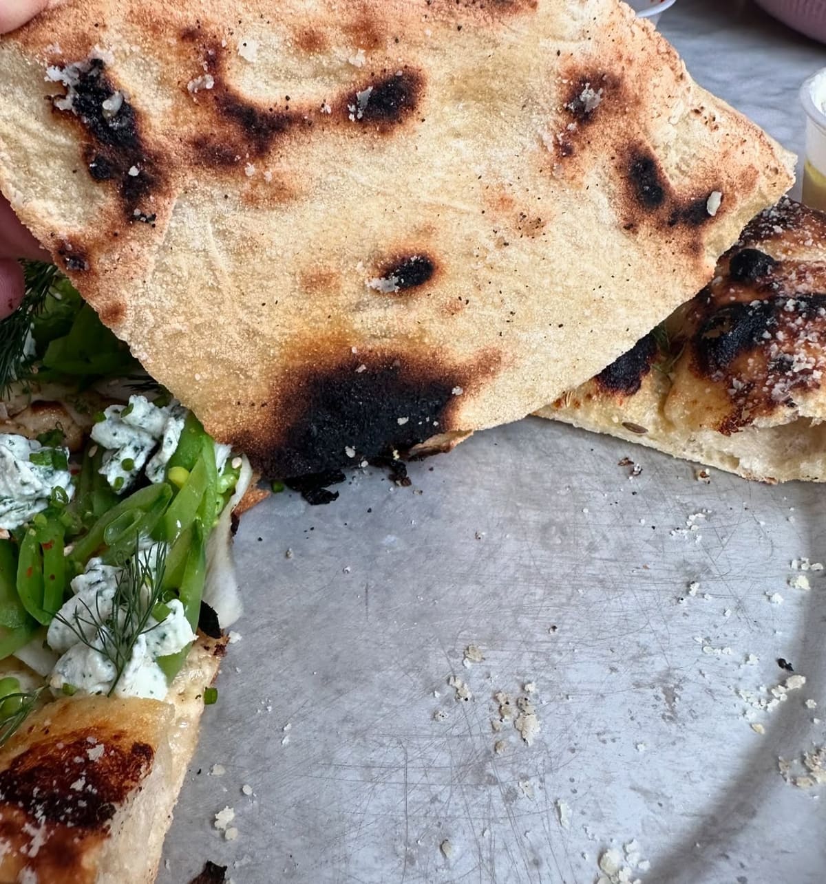 Underside of the pizza crust at Companion Pizza