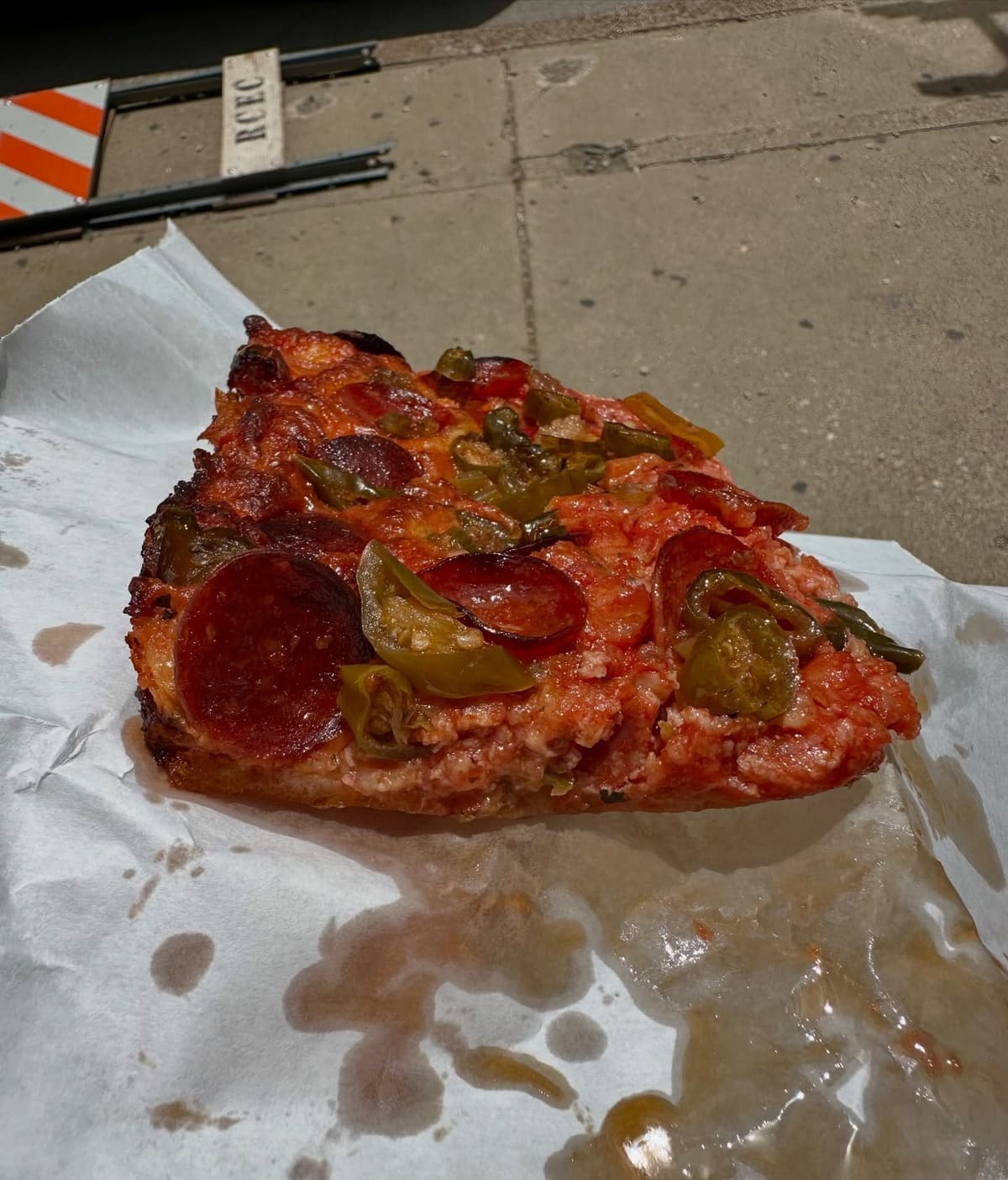 Pizza slice at D’Amato’s Bakery