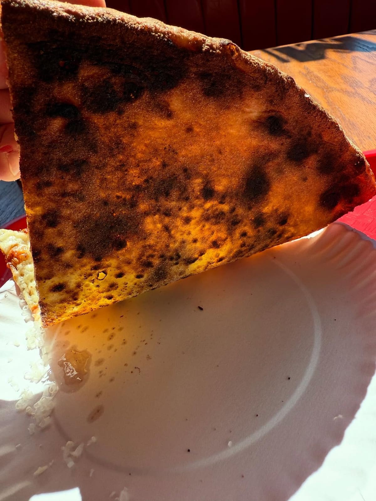 Underside of the pizza crust at Diamond Slice in Greenpoint