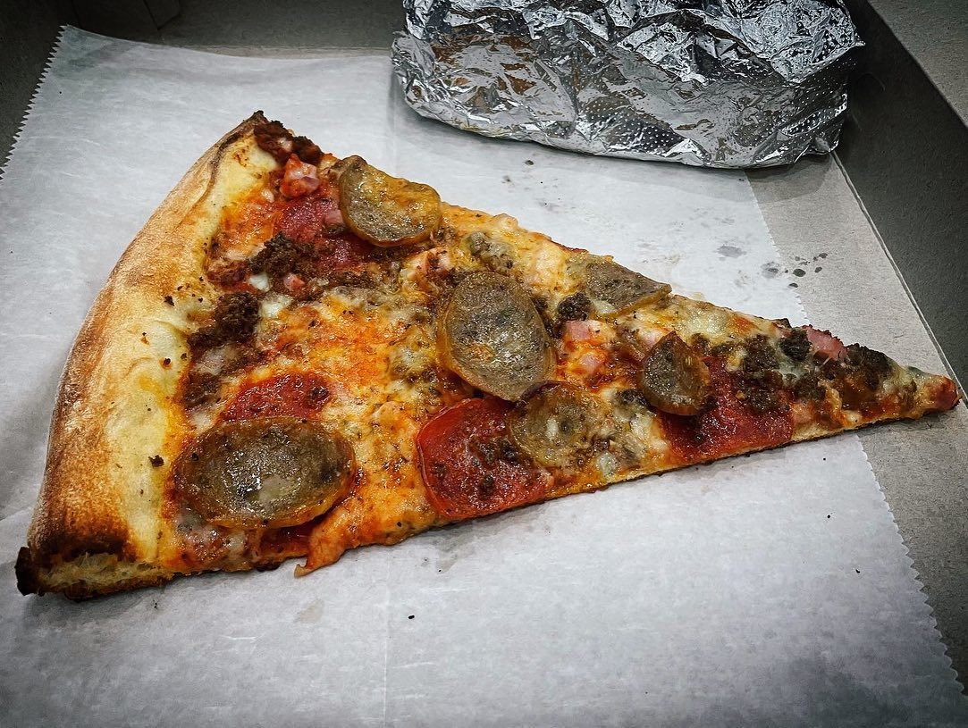 A slice on paper at Downtown House of Pizza