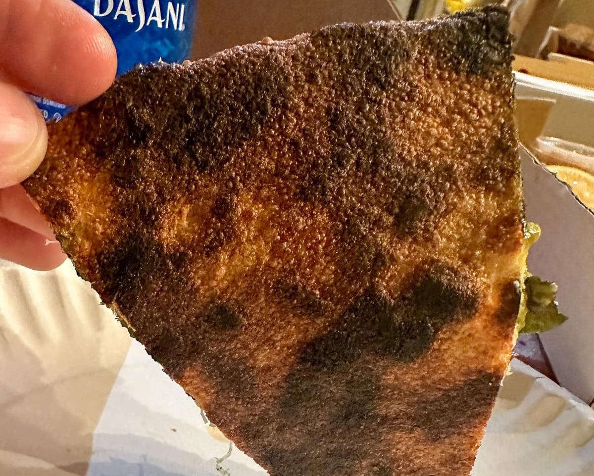 Underside of the pizza crust at El Camino Pizza