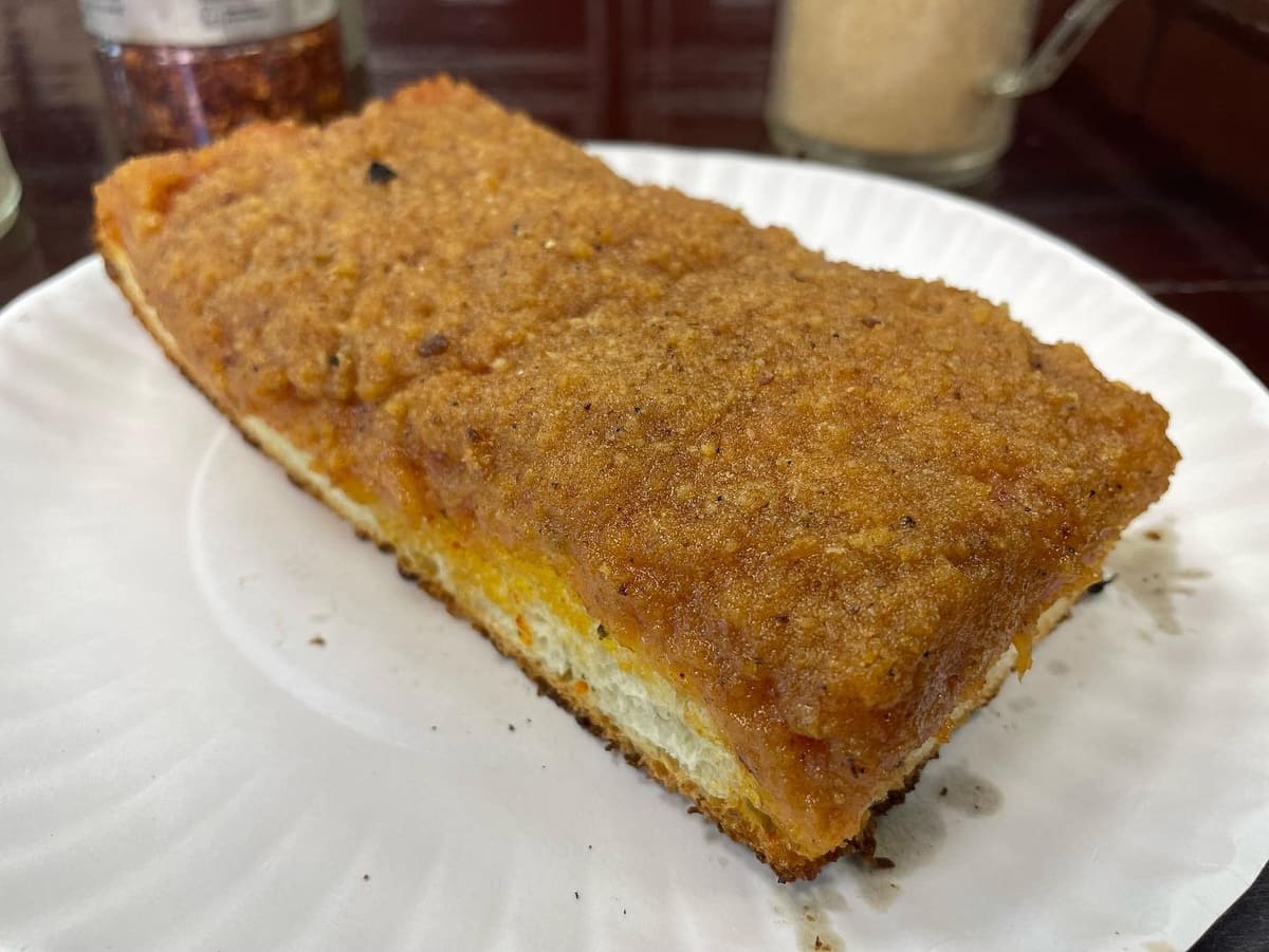 Square pizza slice at Famous Ben’s Pizza