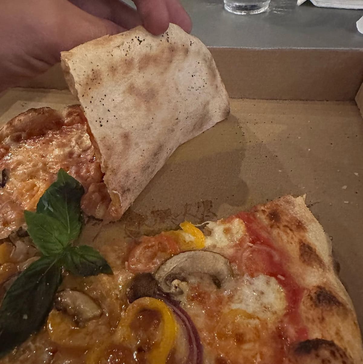 Underside of the pizza crust at Fire Up Pizza