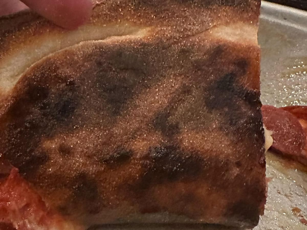 Underside of the pizza crust at Fireside Pizza