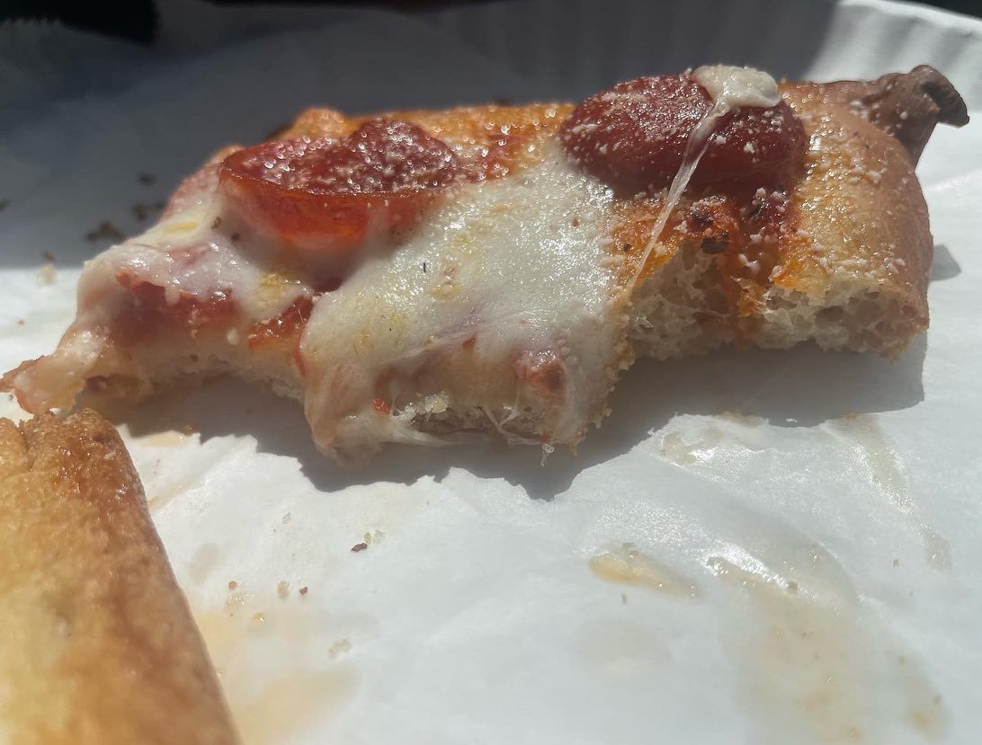 Close view of a pizza slice at Frankie’s Pizza