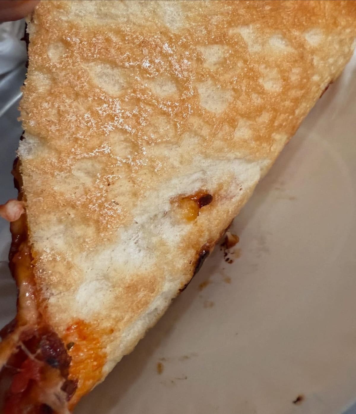 Underside of the pizza crust at Galleria Umberto in North End