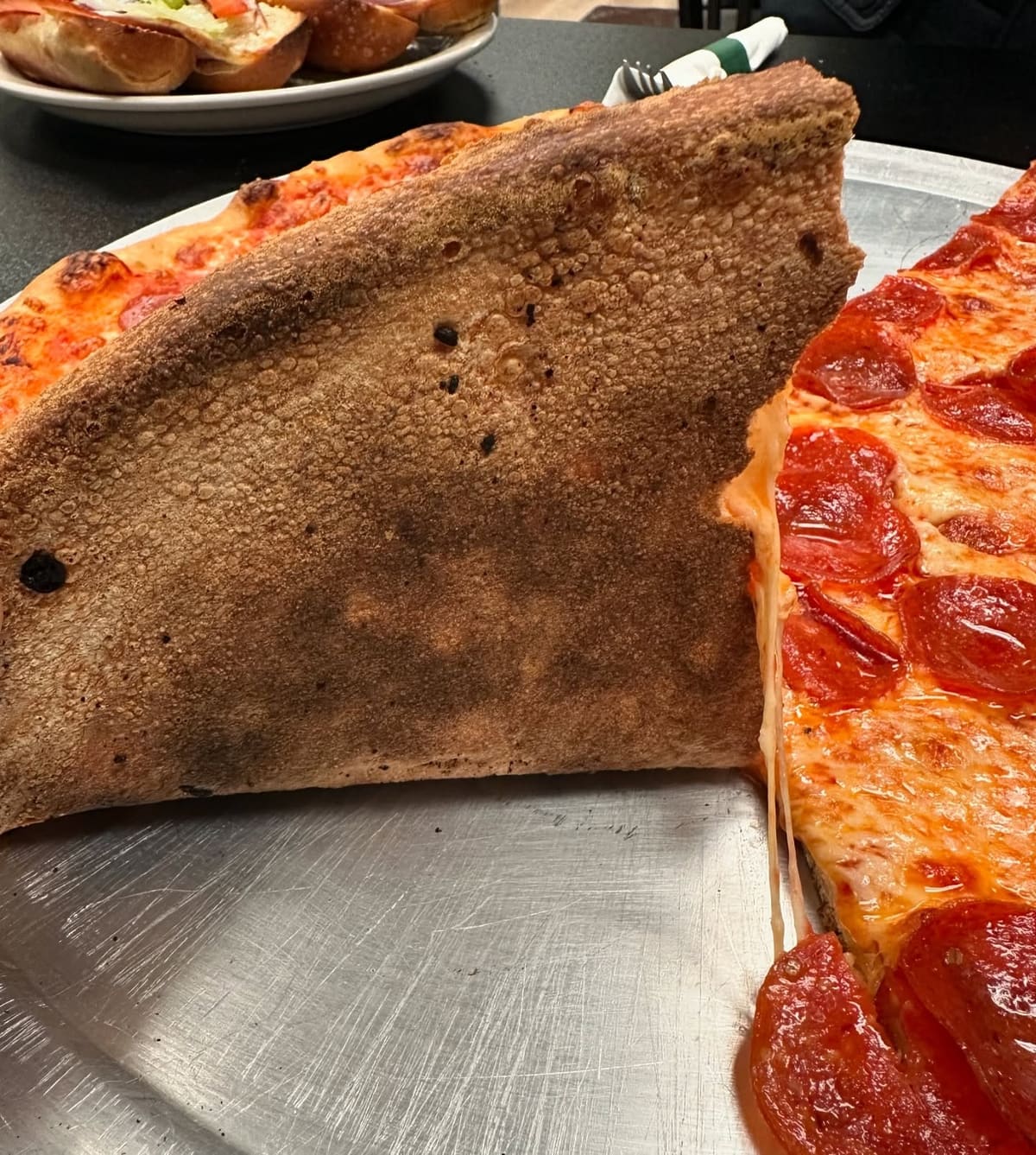 Side profile of the pizza crust at Il Gusto Pizza & Pasta