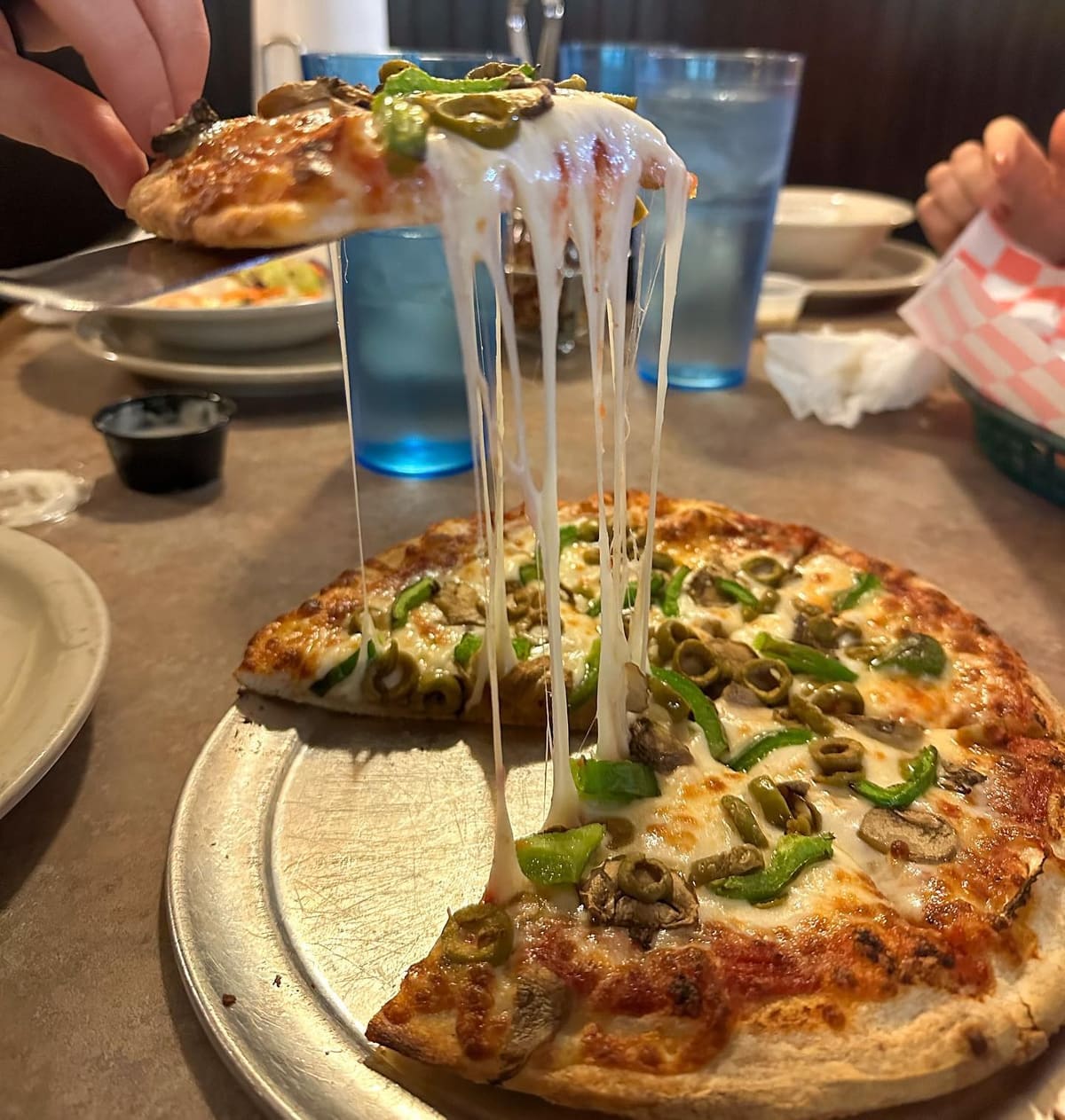 Pizza with melted cheese at Italianette Pizza