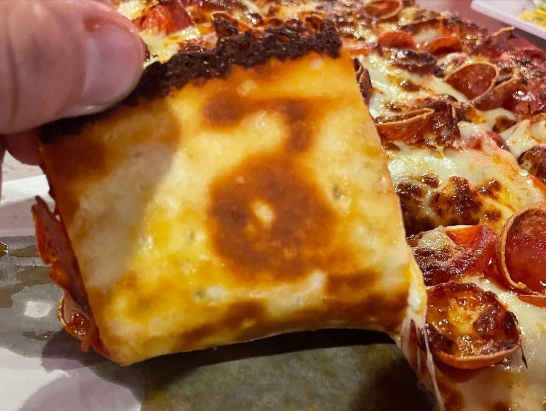 Underside of the pizza crust at Jim & Jack’s