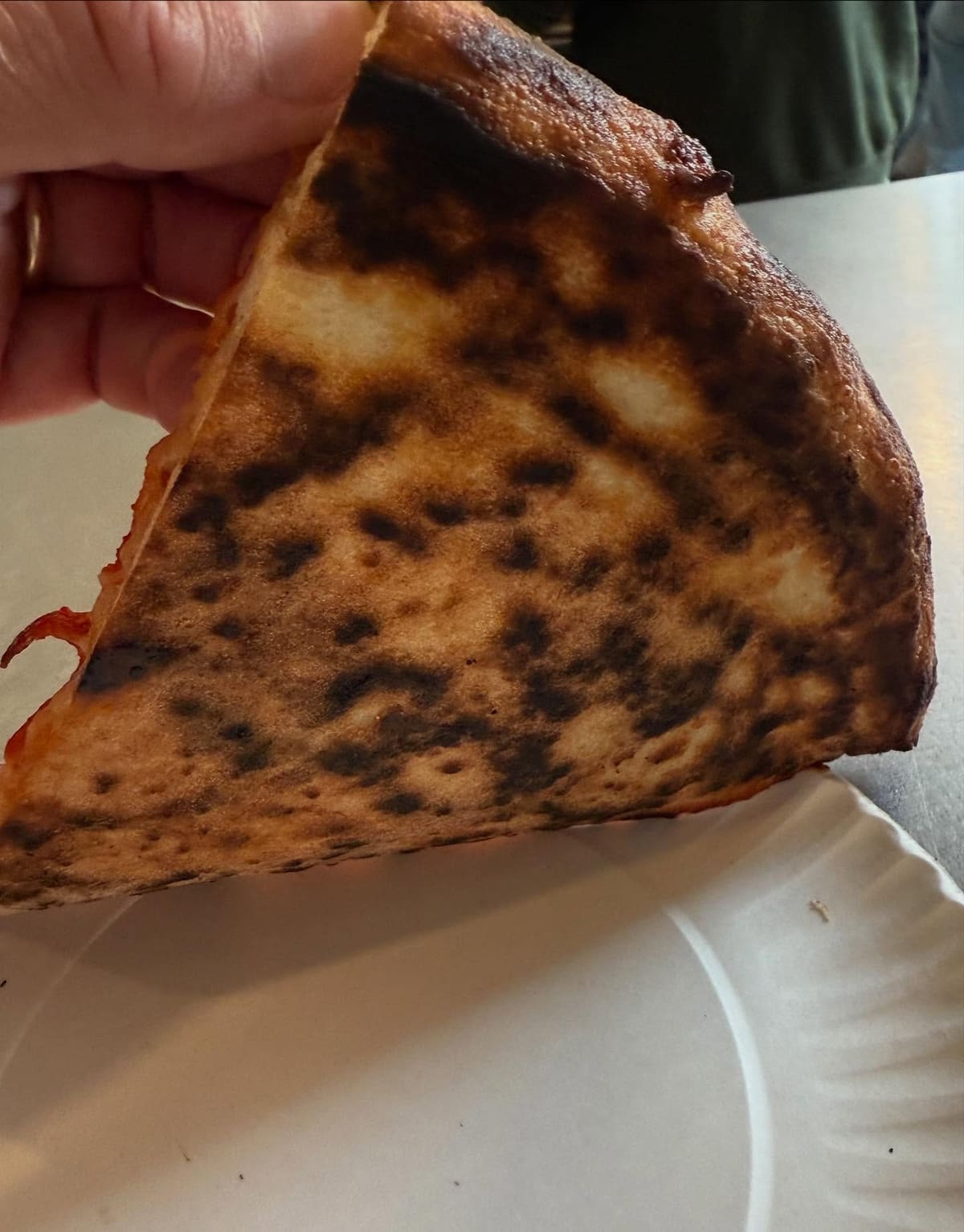 Underside of the pizza crust at Jonny’s Pizza in Lower East Side