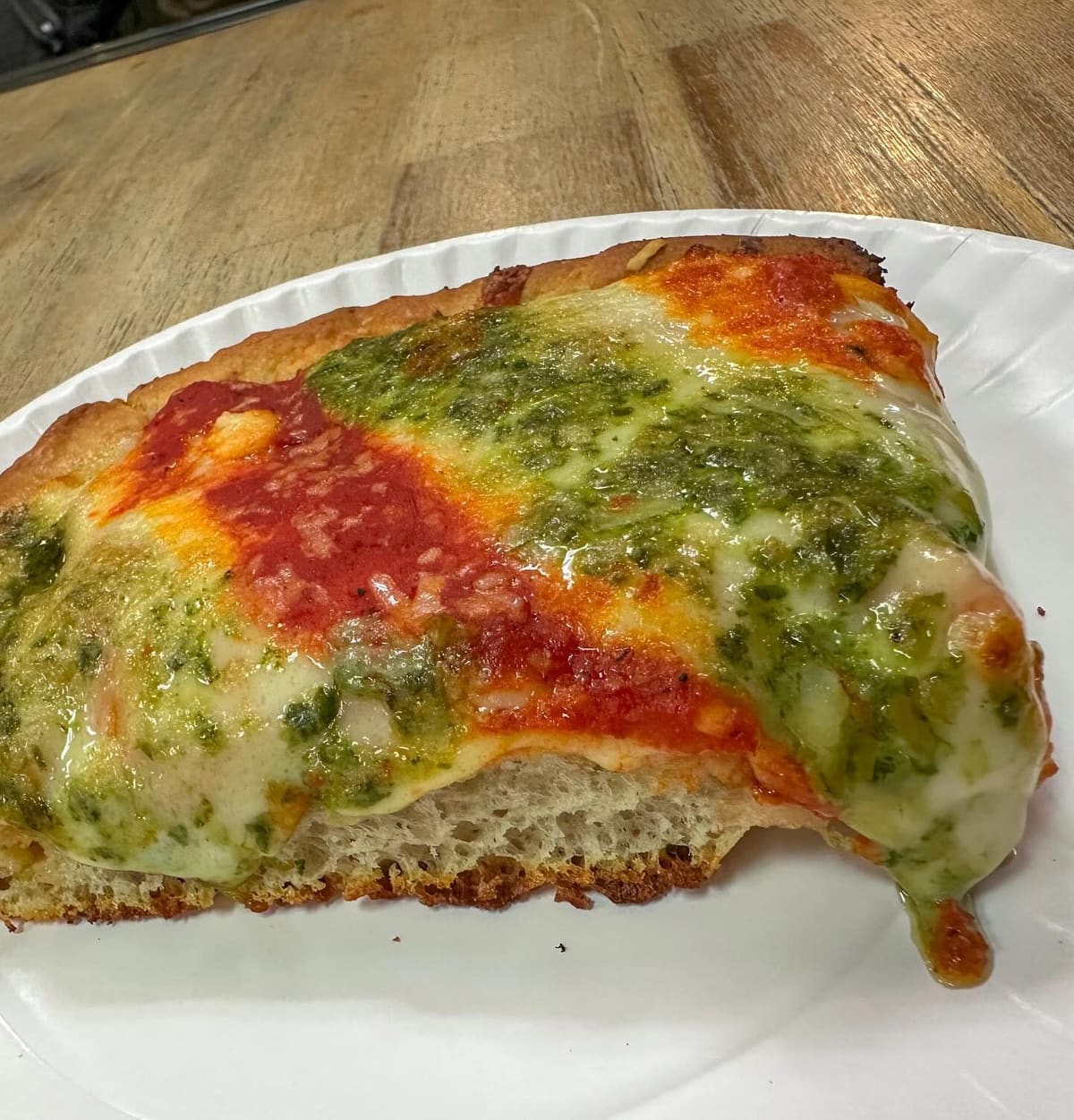 Close view of a pizza slice at Krispy Pizza