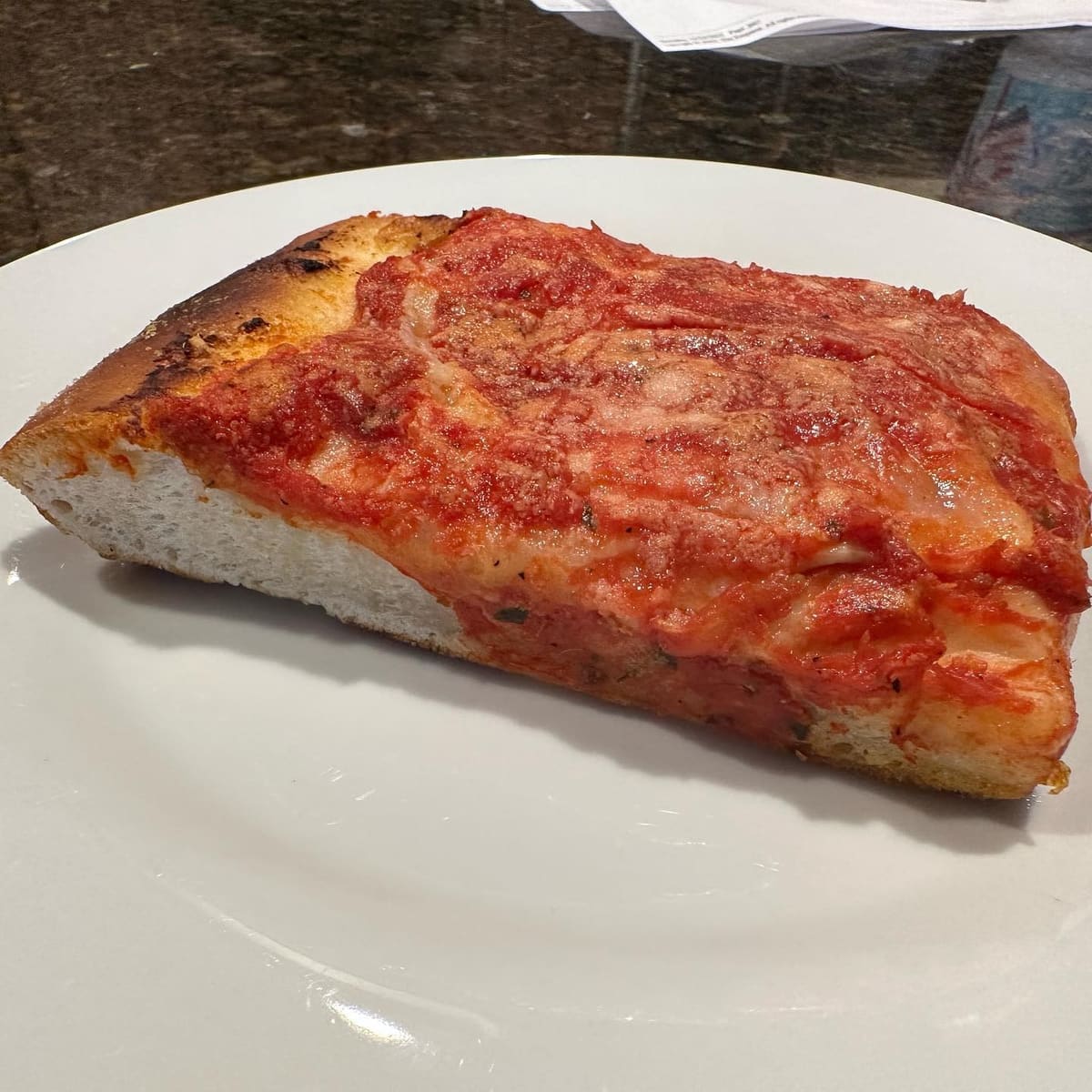 Square pizza slice at L&B Spumoni Gardens