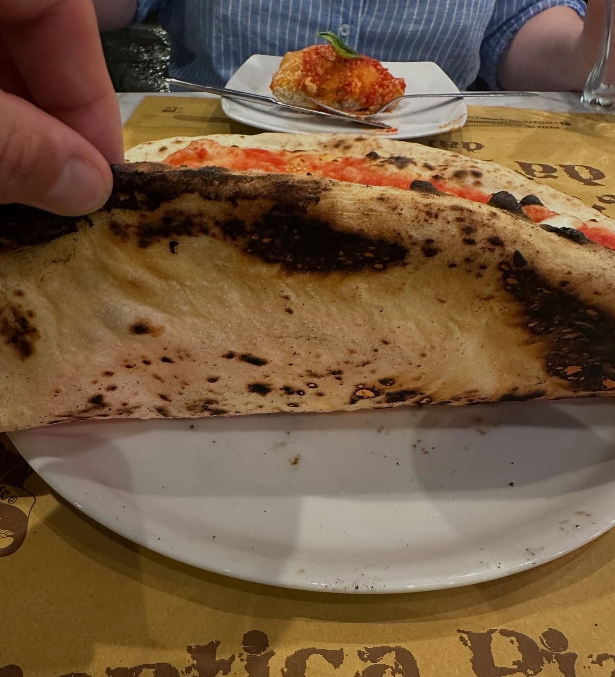 Underside of the pizza crust at L’Antica Pizzeria Da Michele