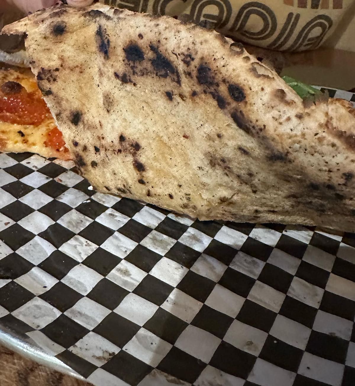 Underside of the pizza crust at Little Hill Pizza
