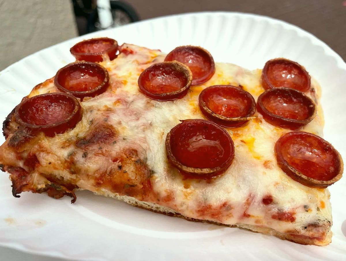 Close view of a pizza slice at Lo Duca Pizza