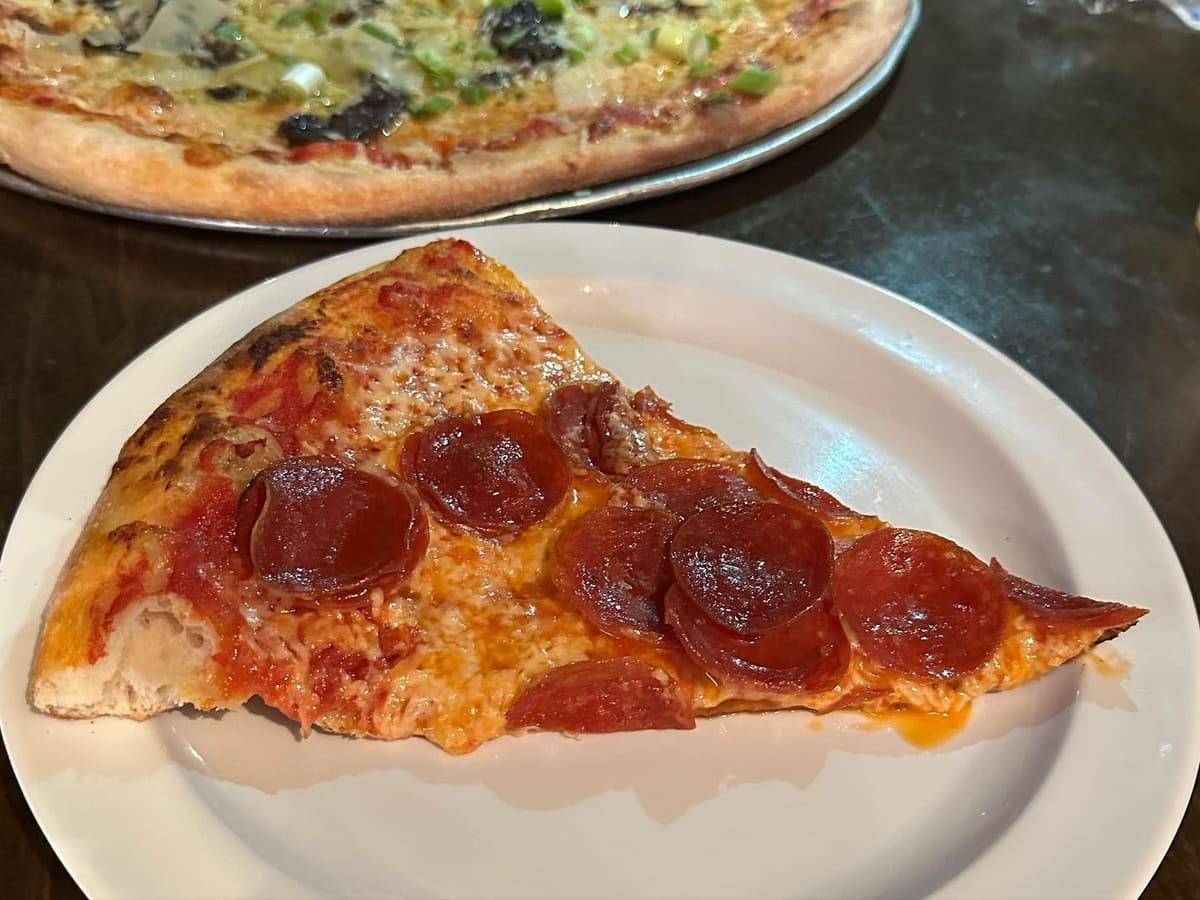 Pizza slice at Mad Monk’s Pizza