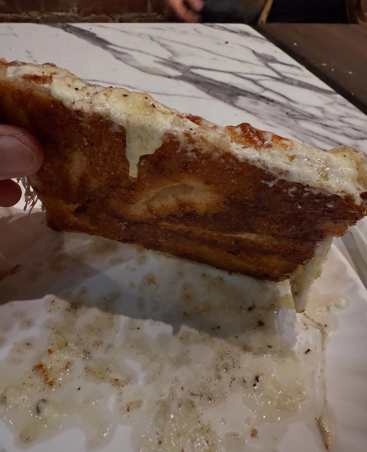 Side profile of the pizza crust at Mama’s Too in West Village