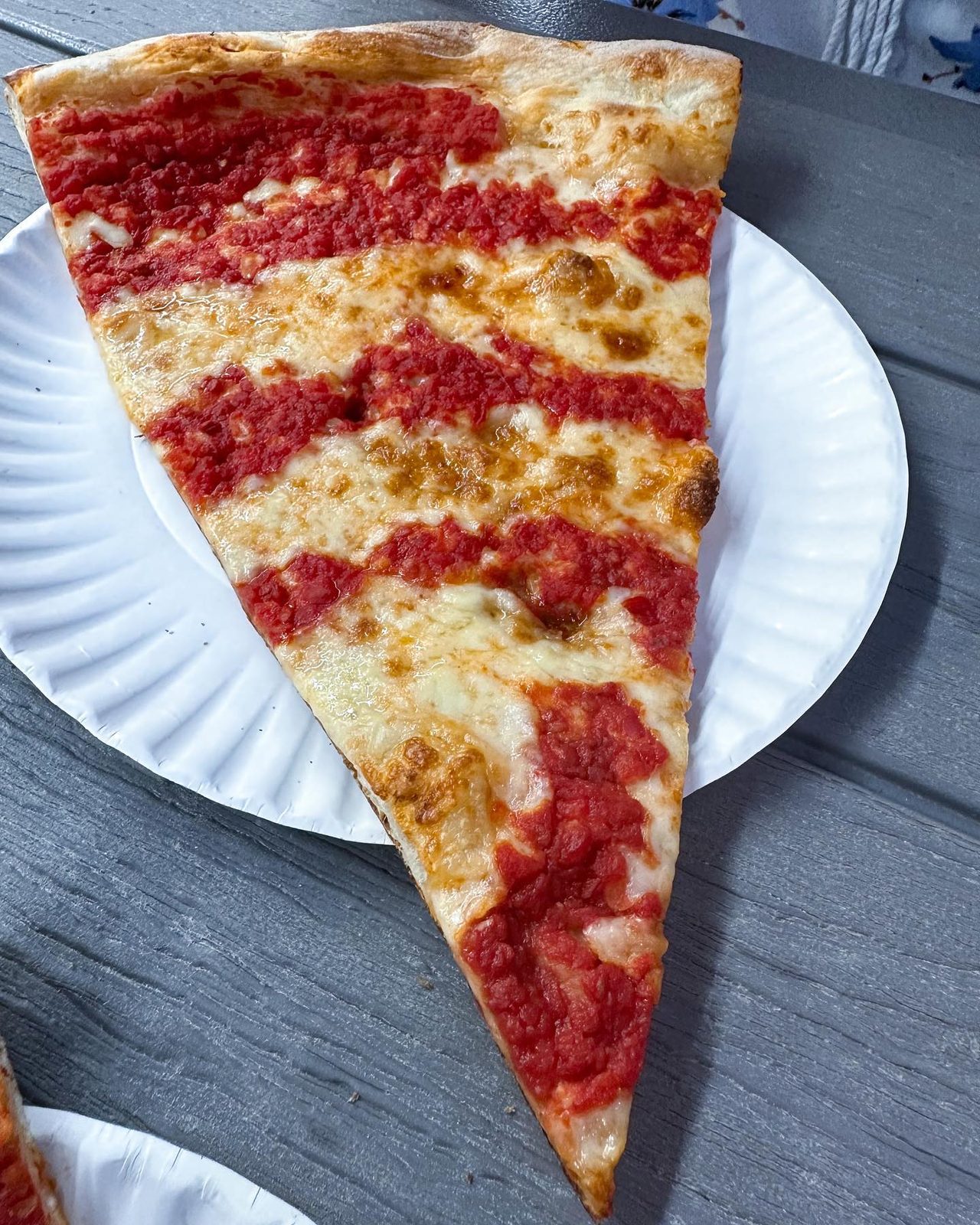 Tomato pie slice with its sauce stripes at Maruca’s Tomato Pies