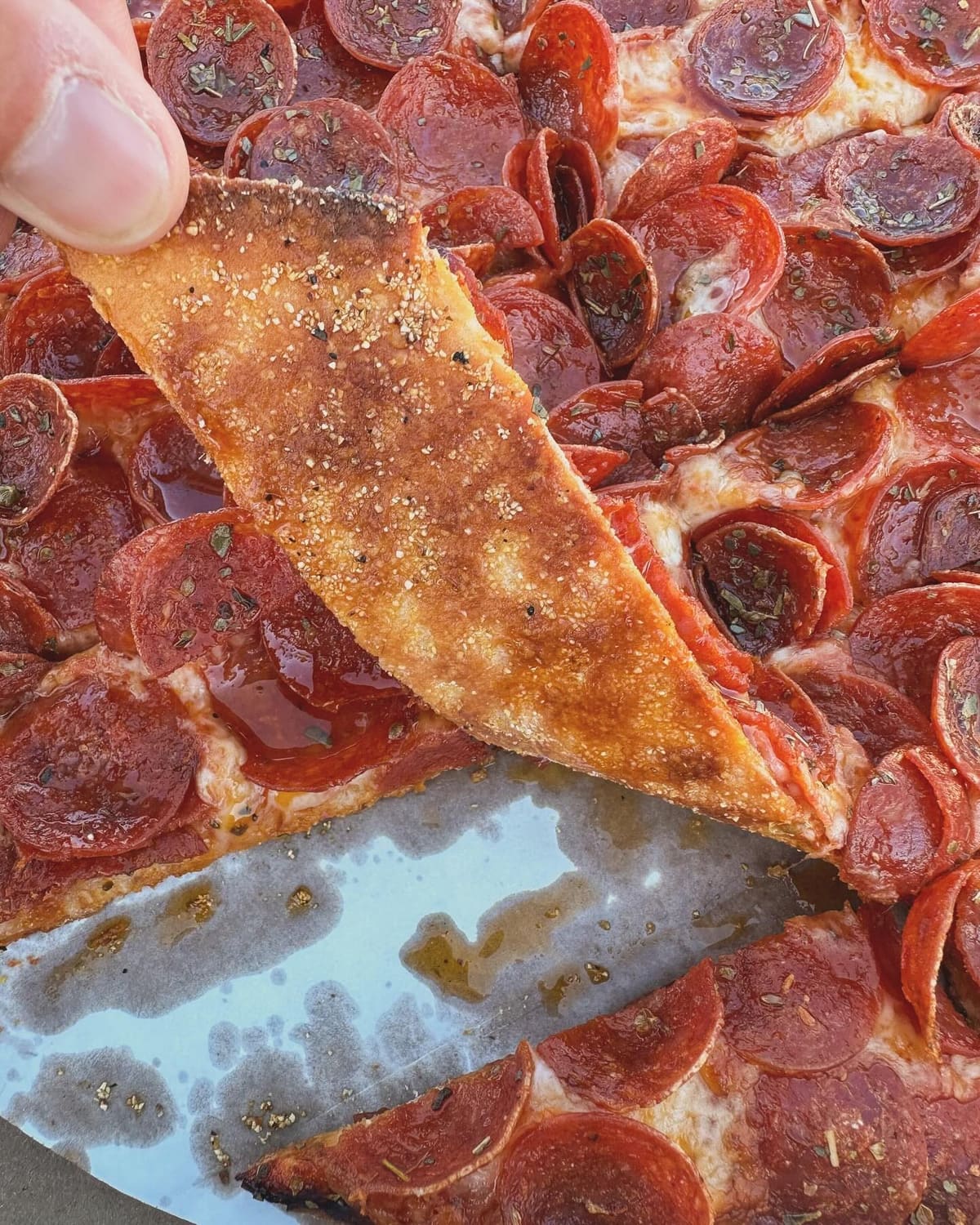 Underside of the pizza crust at Massey’s Pizza
