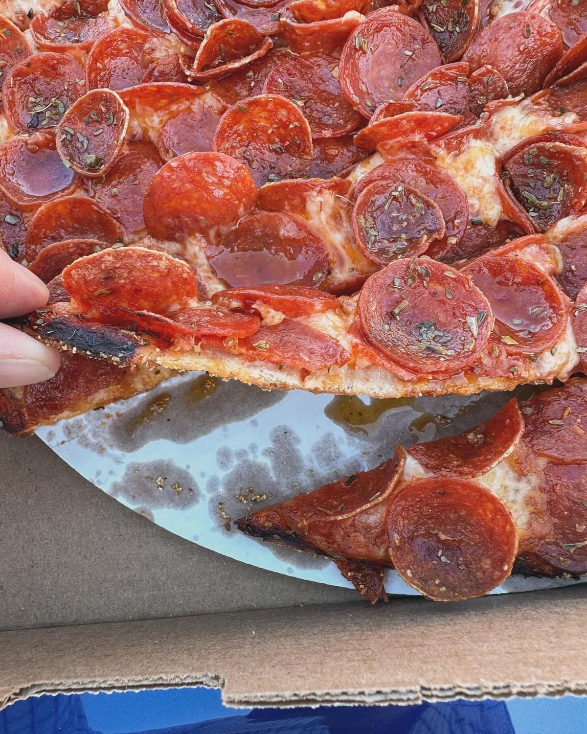 Close view of a pizza slice at Massey’s Pizza