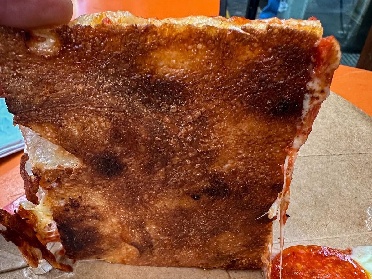 Underside of the pizza crust at My Pie Pizzeria Romana