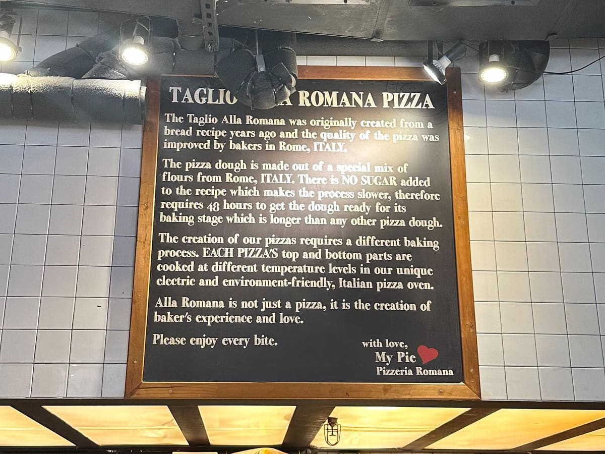 Restaurant sign at My Pie Pizzeria Romana