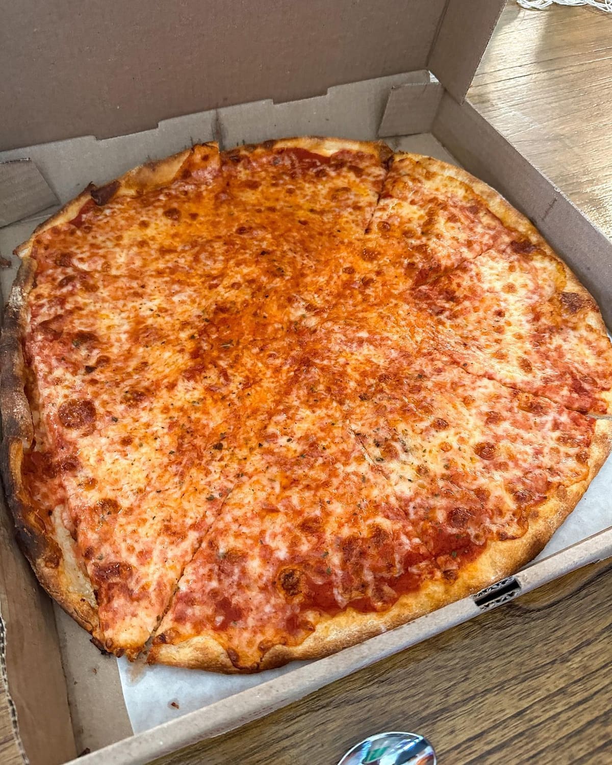 Whole pizza at Naples Pizza & Restaurant